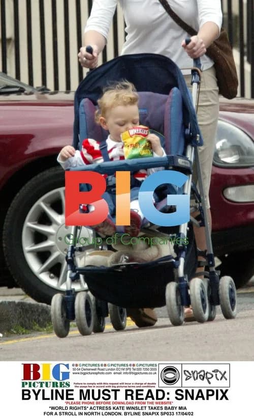 Kate Winslet takes baby Mia for a stroll in North London