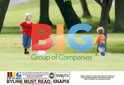 Jude Law with children in London park