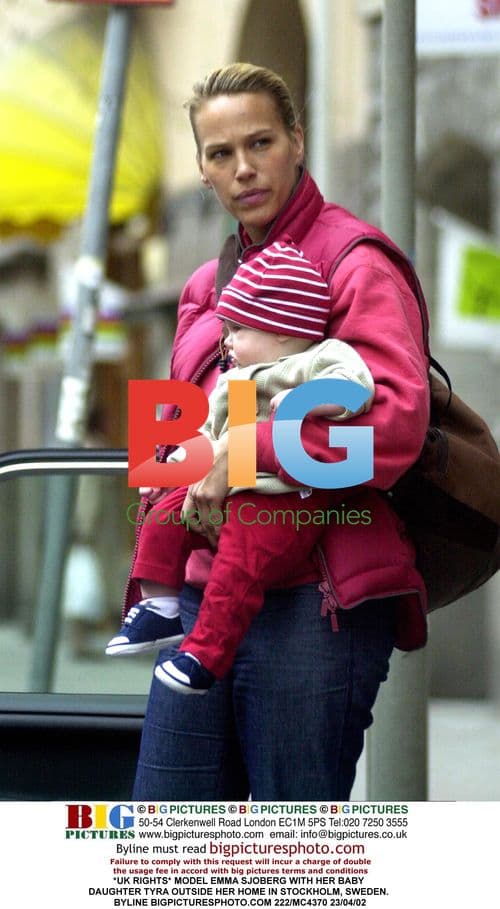 Model Emma Sjoberg with baby daughter in Stockholm