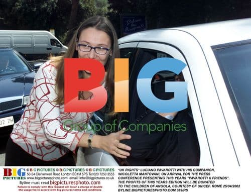 Pavarotti and Companion Arrive at Charity Event