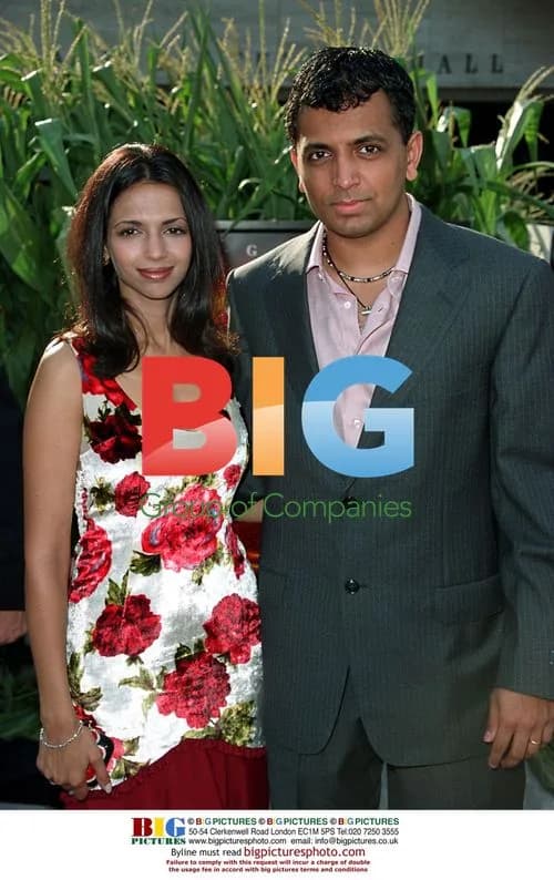 M. Night Shyamalan and wife at "Signs" premiere