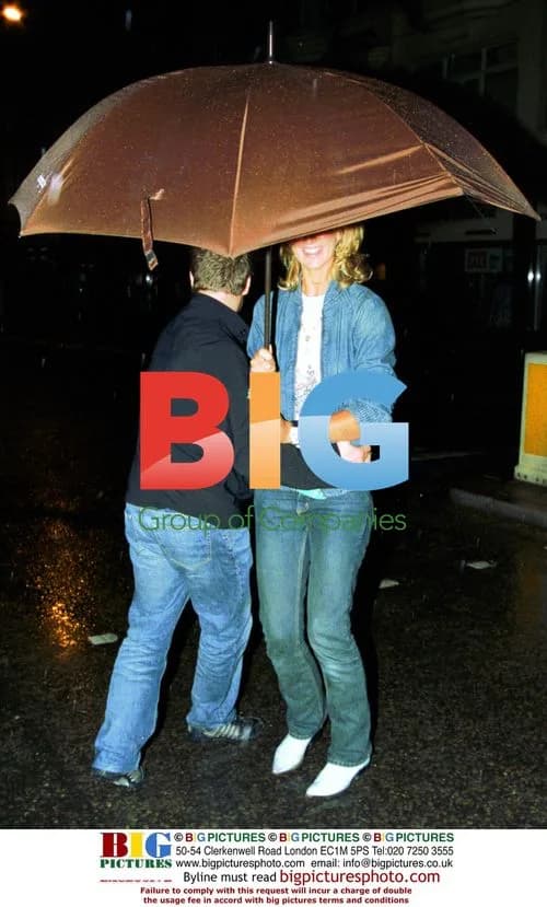 Lady Victoria Hervey and Rankin Under Umbrella