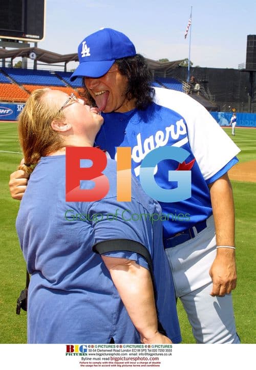 Gene Simmons licks photographer's face