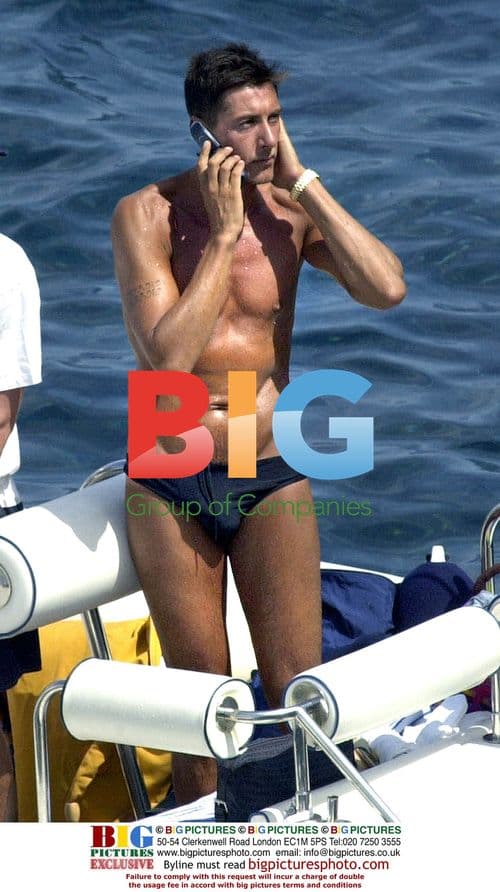 Designers Dolce and Gabbana with Naomi Campbell on Lampedusa