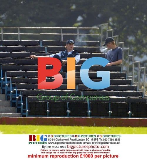 Prince Harry smoking at polo match with friend