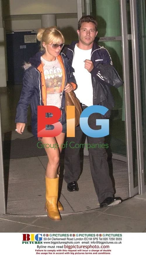 Geri Halliwell and boyfriend dash through airport