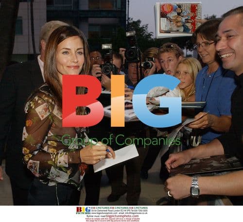 Courteney Cox signs autographs at "Serving Sara" premiere