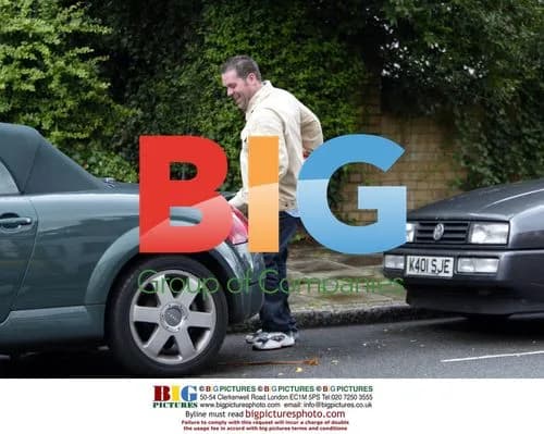 DJ Chris Moyles Loads Beer and Snacks into Car