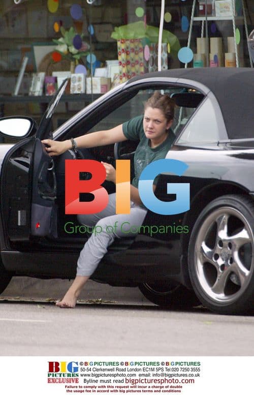 Drew Barrymore goes shoeless to yoga and shopping