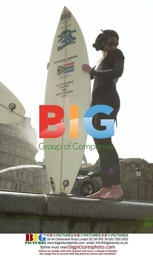 Surfer demonstrating with sewage bag