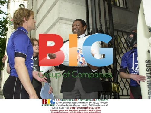 Surfer presents sewage sludge to ambassador