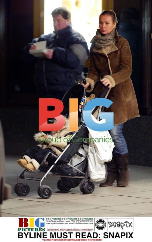 Agnethe Petit waits for husband Emmanuelle outside Harrods