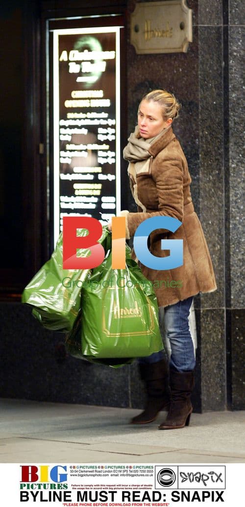 Displeased wife waits for husband after Harrods shopping