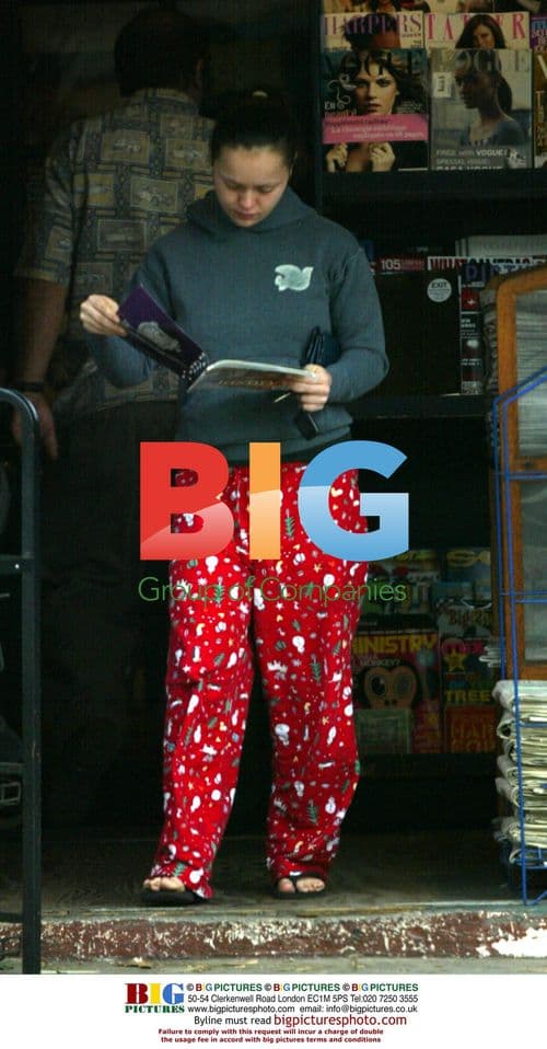 Christina Ricci Checks Magazine at News Stand