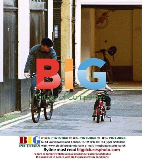 Guy Ritchie and son Rocco on bikes in London