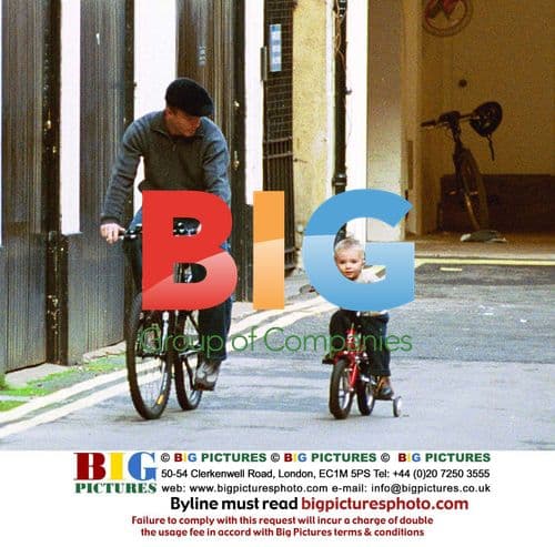 Guy Ritchie and son Rocco on bikes in London