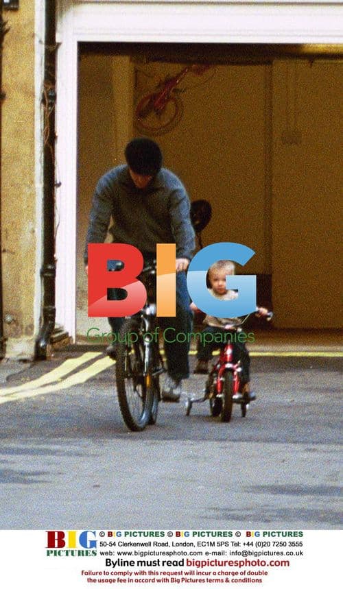 Guy Ritchie and son Rocco on bikes in London