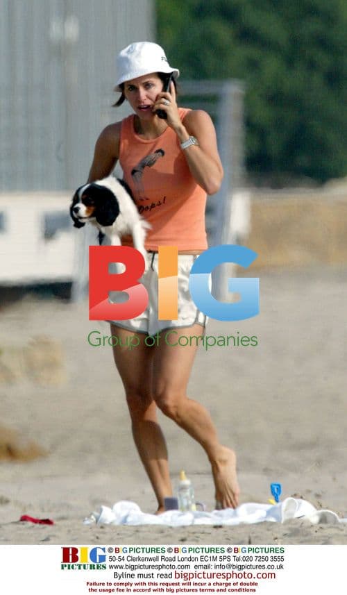 Courteney Cox with Puppy on Beach