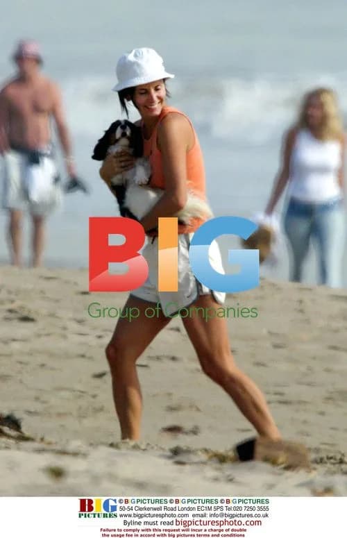 Courteney Cox with Puppy on Beach