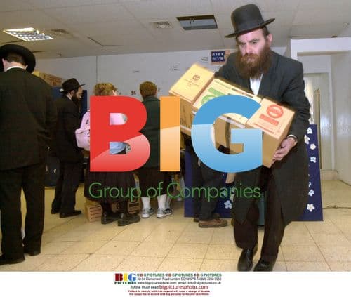 Orthodox Jewish man picking up gas masks