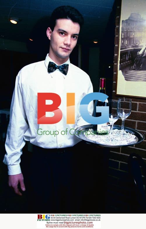 Restaurant Waiter Serving Wine