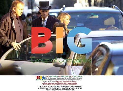 Mick Jagger Leaves Paris Restaurant with Woman