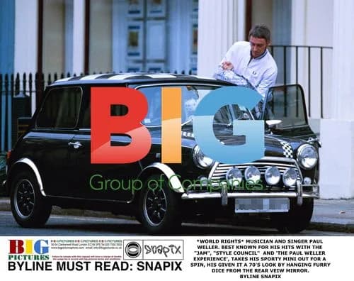 Paul Weller driving sporty Mini