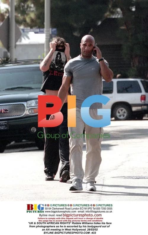 Robbie Williams Exiting AA Meeting