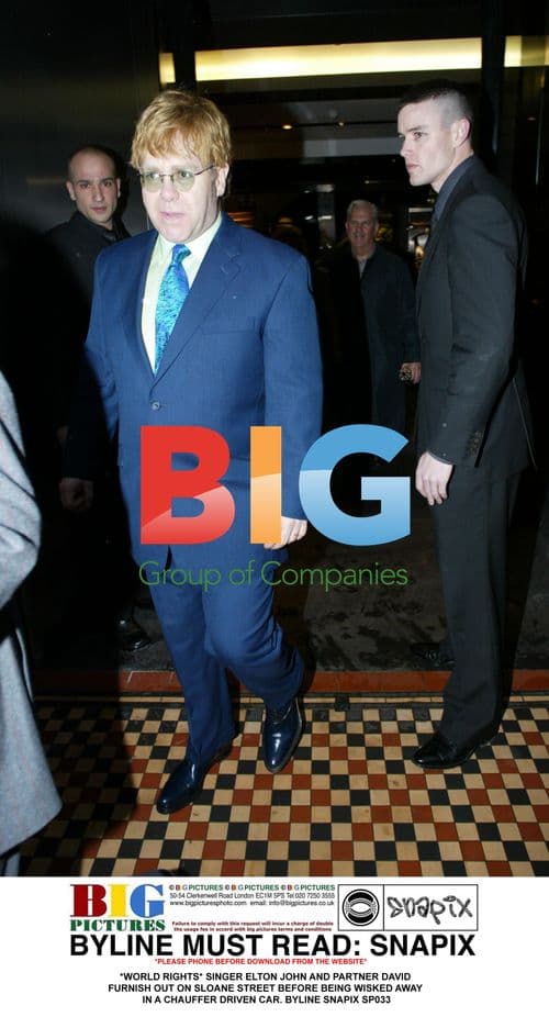 Elton John and David Furnish Leaving Sloane Street