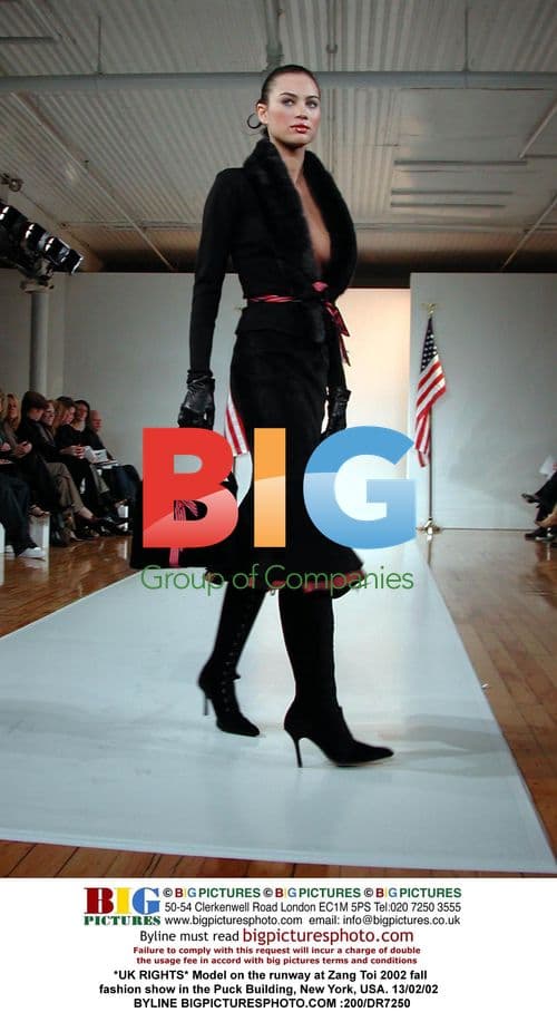 Model walks Zang Toi runway at 2002 show