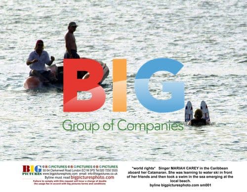 MARIAH CAREY water skis in the Caribbean