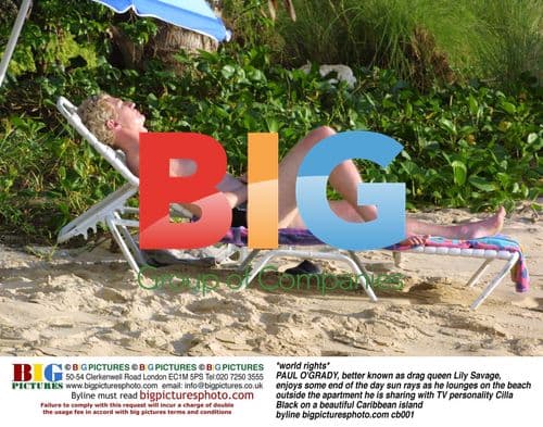 Paul O'Grady Lounges on Caribbean Beach