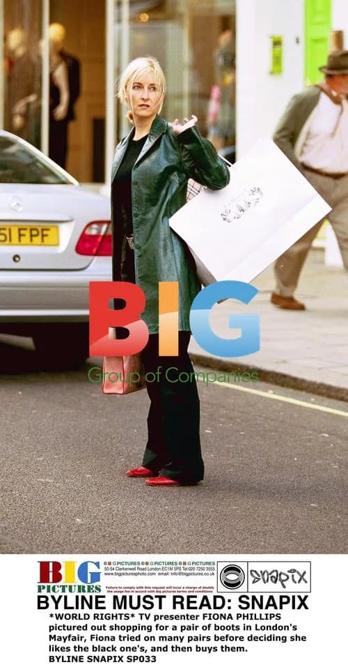 FIONA PHILLIPS Buys Boots in Mayfair