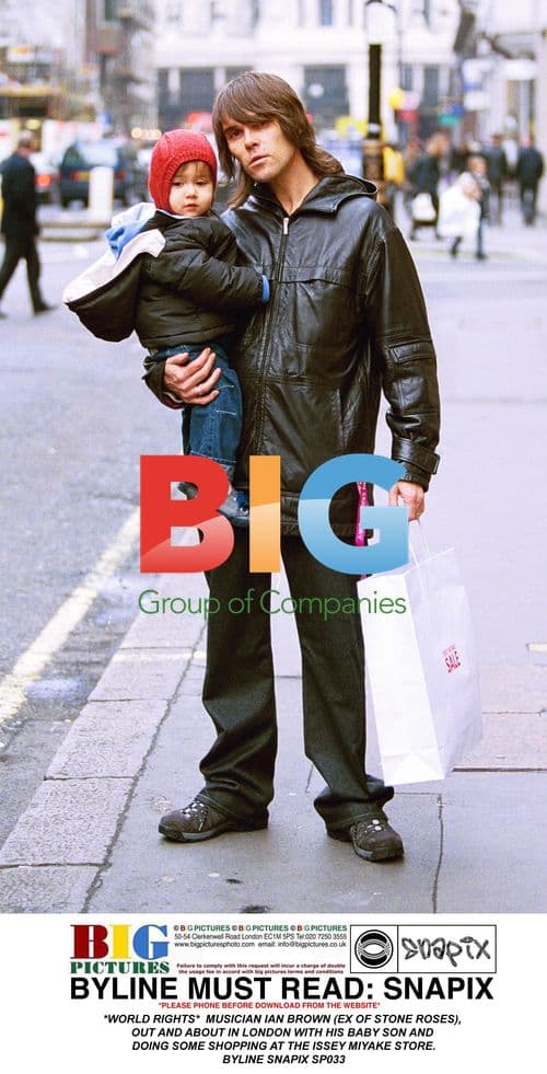 Musician Ian Brown with baby son in London