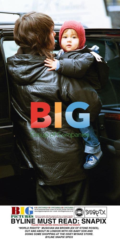 Ian Brown out shopping in London with baby son