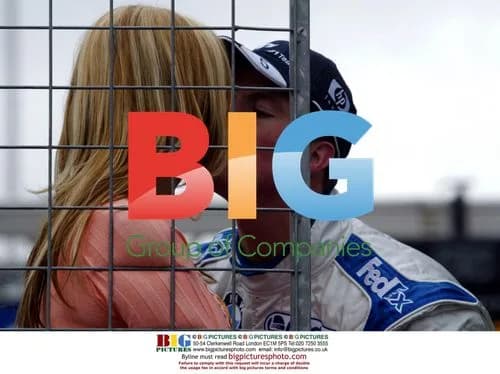 Ralf Schumacher gives wife Cora a pre-race kiss