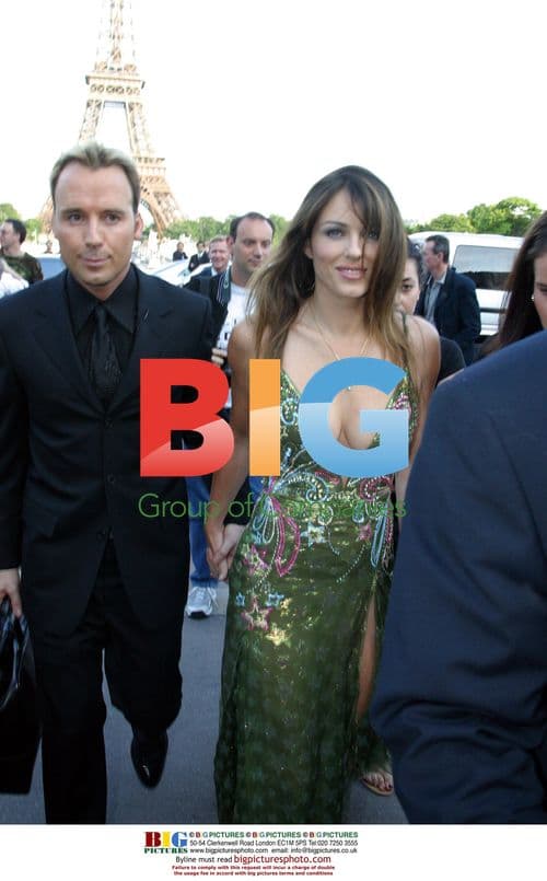 Liz Hurley and David Furnish at Versace show