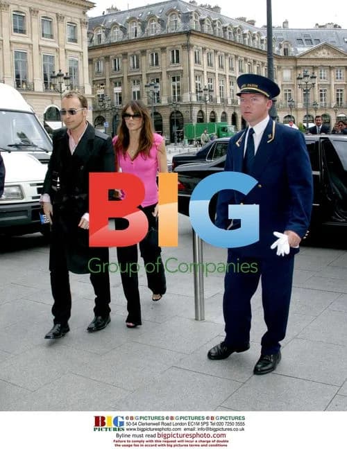 Liz Hurley shops on Champs-Élysées with David Furnish
