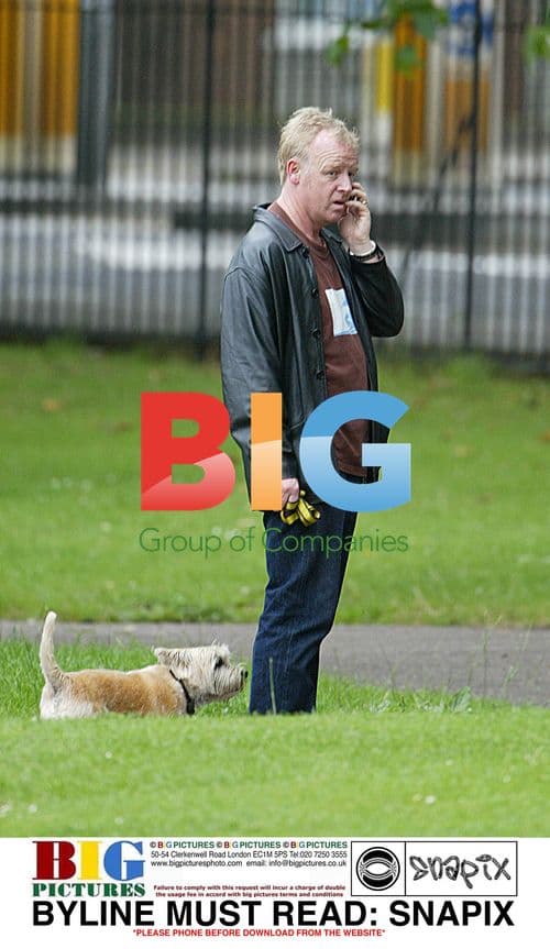 LES DENNIS walking dogs in London park