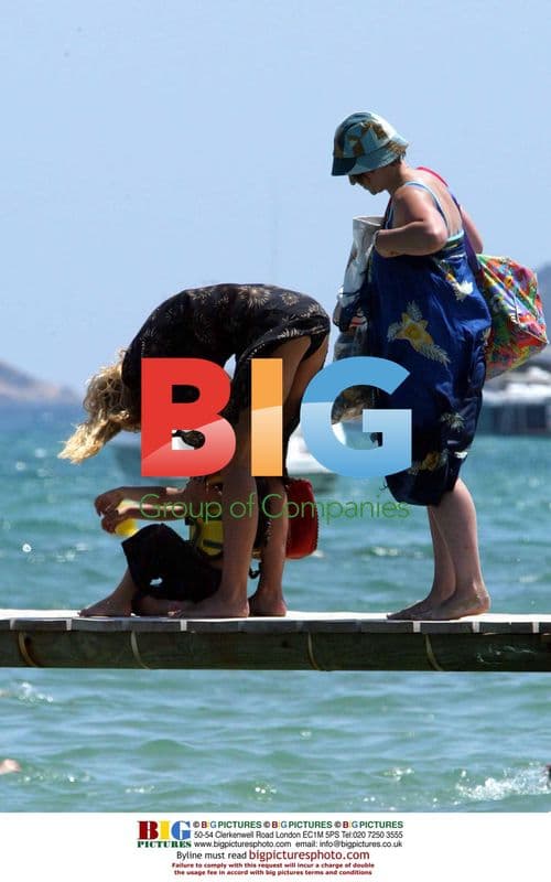 Jerry Hall and son at beach club