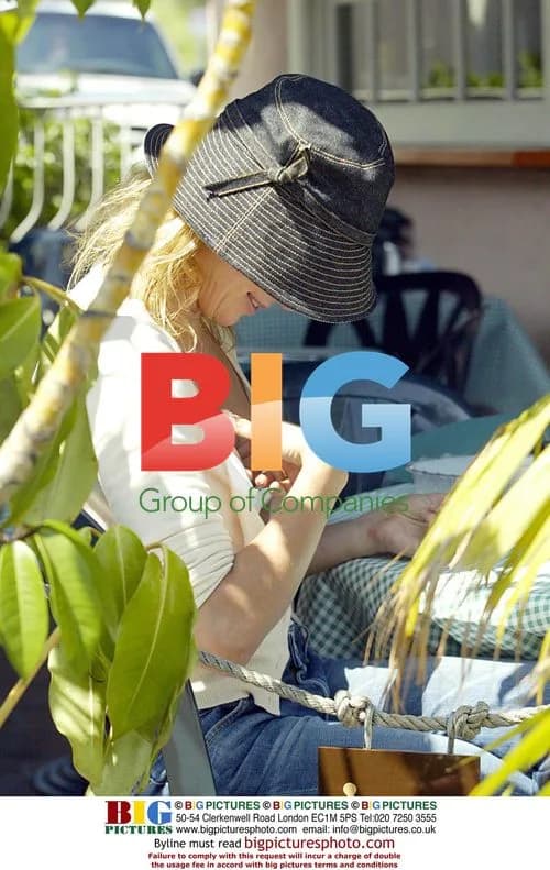 Charlize Theron drops item down top at restaurant