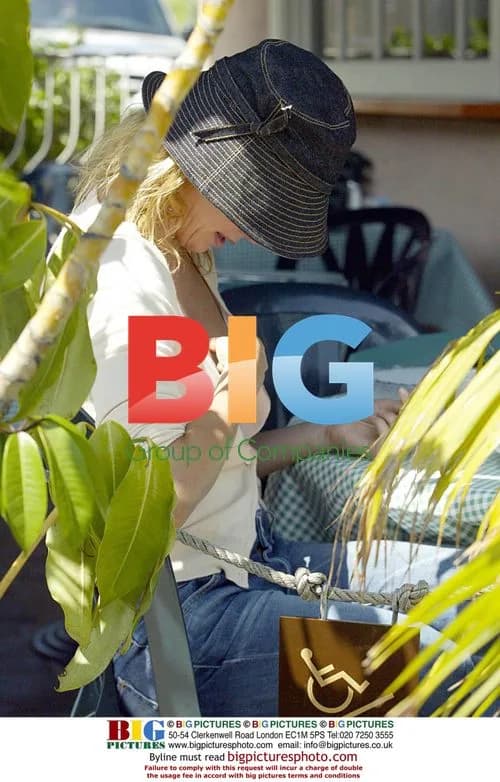 Charlize Theron drops something down top