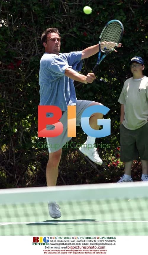 Matthew Perry playing tennis at Playboy Mansion