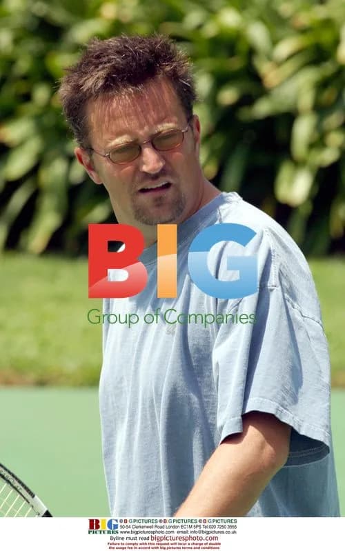 Matthew Perry playing tennis at Playboy Mansion