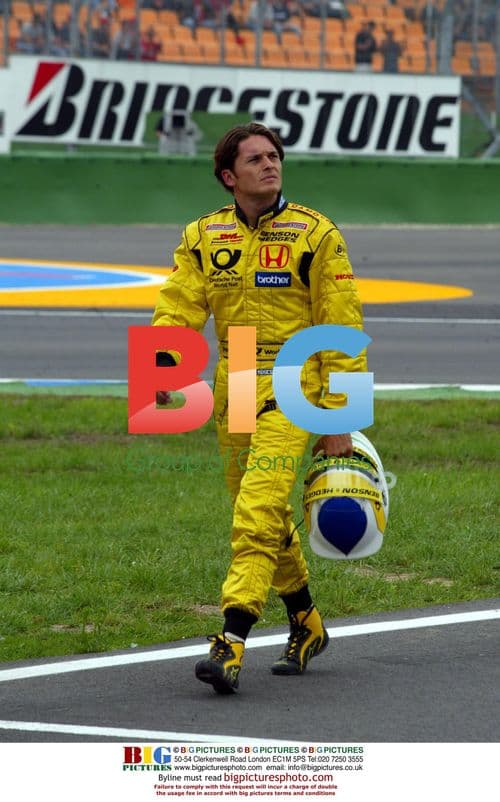 Giancarlo Fisichella walks back to pits