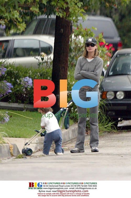Calista Flockhart with trainer and son at beach