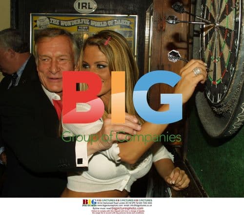 Jordan and Hugh Hefner play darts