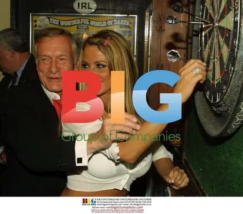 Jordan and Hugh Hefner play darts