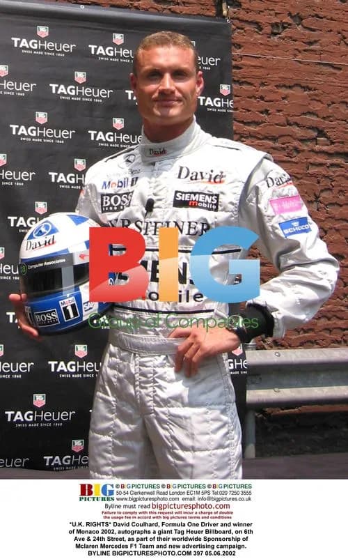 David Coulthard autographs Tag Heuer billboard