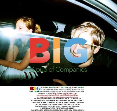 Leonardo DiCaprio Tries to Hide from Cameras